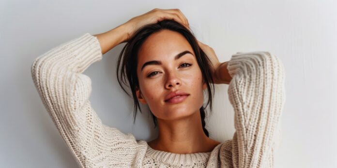 Portrait of a young positive woman looking at the camera